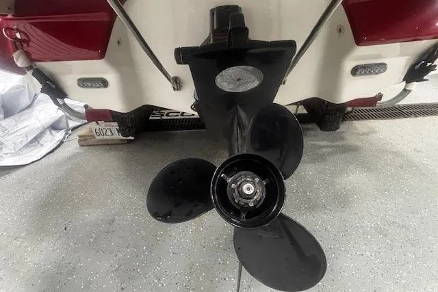 Slide: The Image of Propeller of a 2008 Monterey 194FS boat in a garage setting. - 33