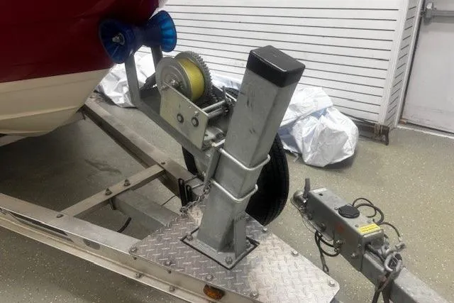 Slide: The Image of 2008 Monterey 194FS boat trailer with winch and hitch in a garage setting. - 35