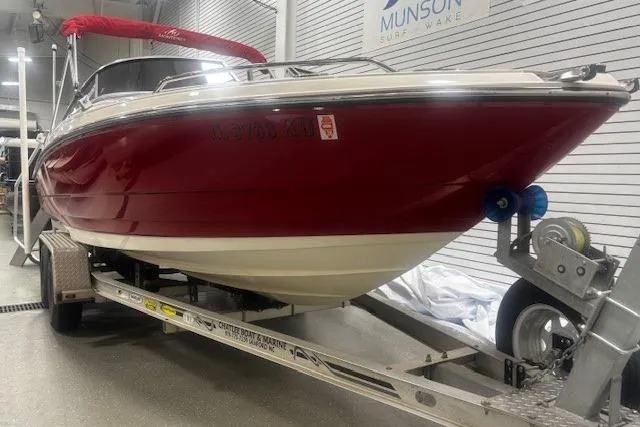 Slide: The Image of Red 2008 Monterey 194FS boat on trailer in indoor showroom. - 36