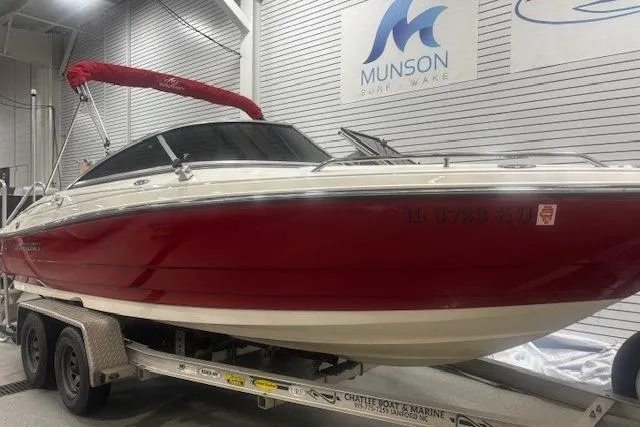 Slide: The Image of 2008 Monterey 194FS boat with red hull on trailer in showroom. - 5