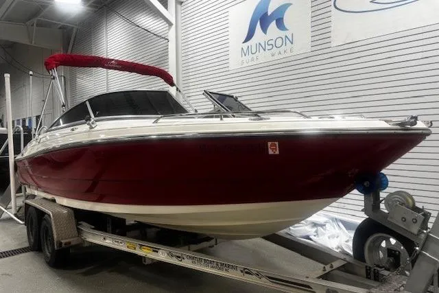 Slide: The Image of 2008 Monterey 194FS boat with red hull on trailer in showroom. - 6