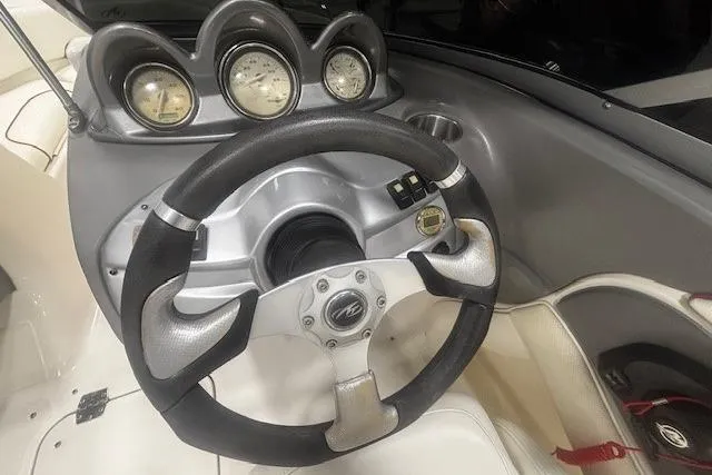 Slide: The Image of Steering wheel and dashboard of a 2008 Monterey 194FS boat. - 8