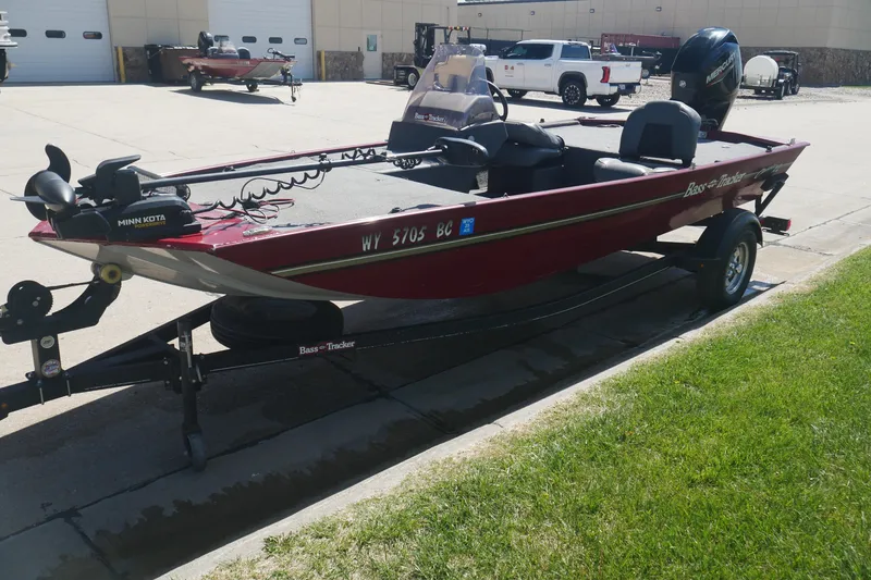 Slide: The Image of 2022 Tracker Bass Tracker Classic XL boat on trailer in parking lot. - 2