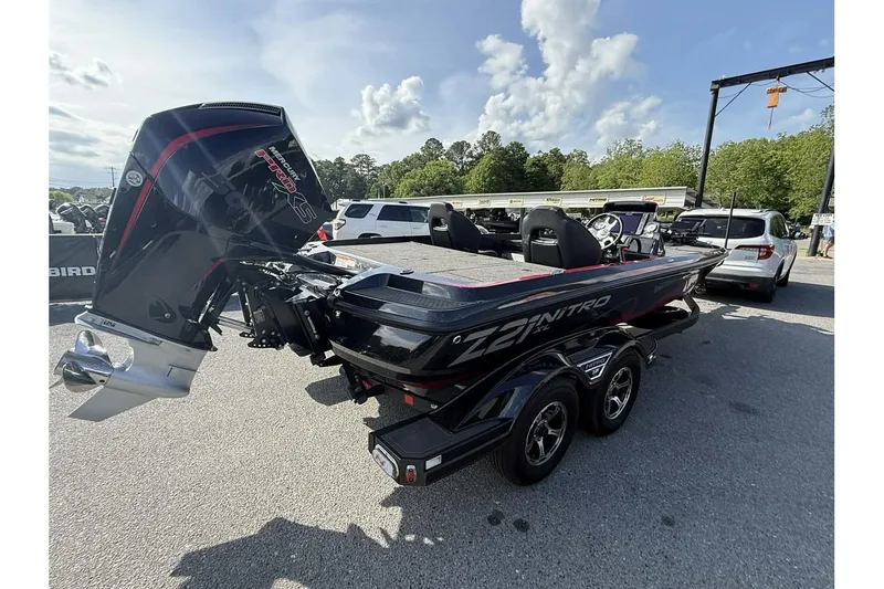 Slide: The Image of 2023 Nitro Z21 XL Pro boat with powerful engine, parked outdoors on a sunny day. - 5