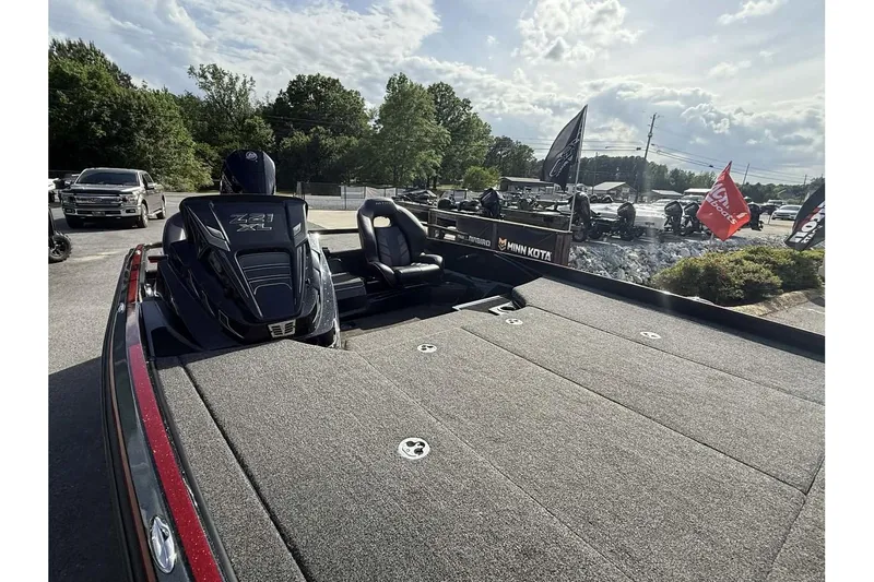 Slide: The Image of 2023 Nitro Z21 XL Pro boat with spacious deck, parked outdoors under a cloudy sky. - 6