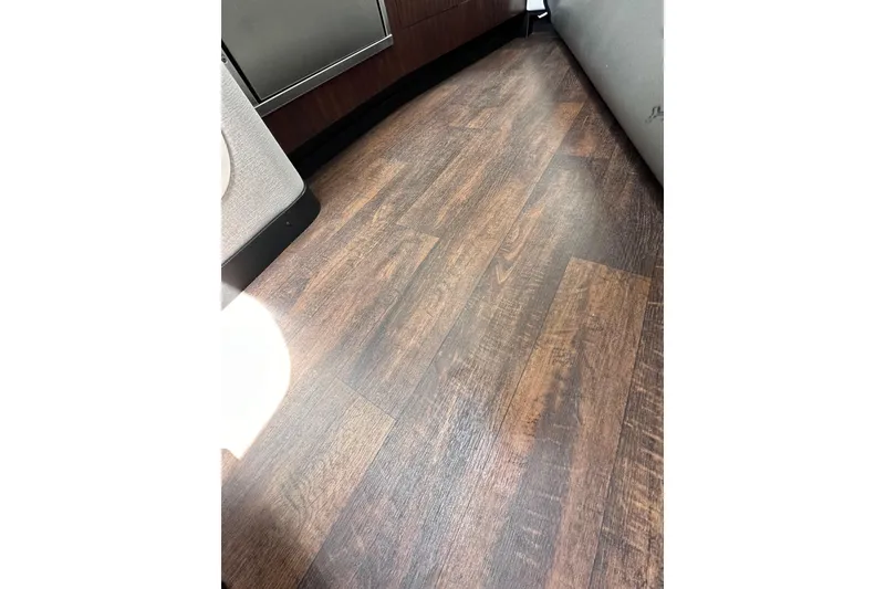 Slide: The Image of Wooden flooring inside a 2020 Monterey 355 Sport Yacht, showcasing elegant interior design. - 59