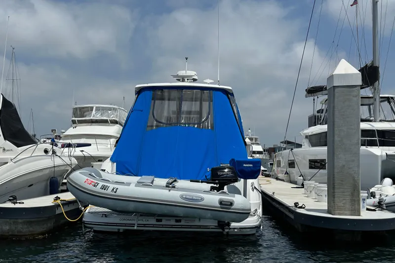 Slide: The Image of 2020 Monterey 355 Sport Yacht docked with inflatable boat attached. - 61