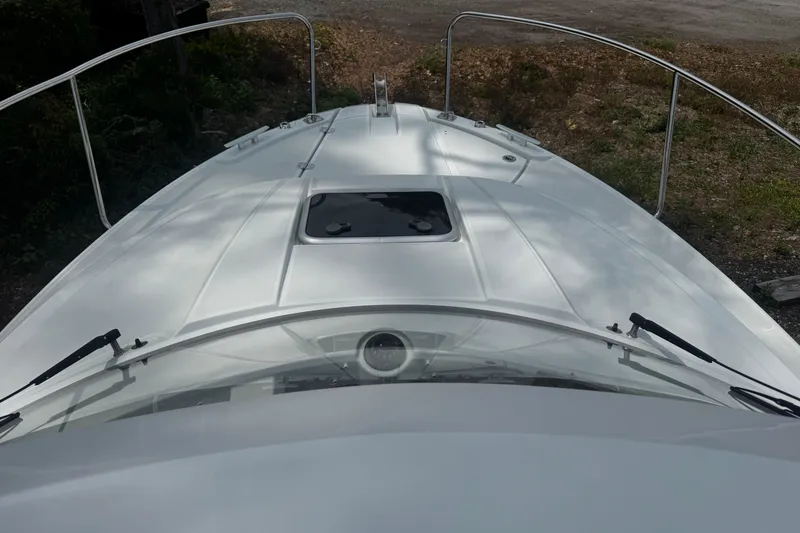 Slide: The Image of 2019 Jeanneau NC 795 boat deck with hatch and railing, viewed from above. - 18