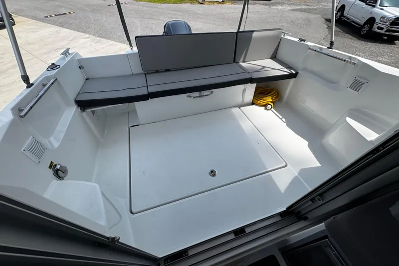 Slide: The Image of 2019 Jeanneau NC 795 boat interior with seating and storage area. - 3