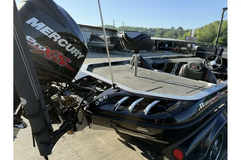 Slide: The Image of 2016 Ranger Z521 Comanche boat with Mercury Pro XS engine, parked outdoors. - 21