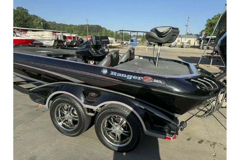 Slide: The Image of 2016 Ranger Z521 Comanche boat with sleek black design and dual axle trailer. - 3