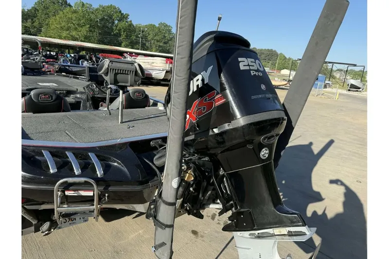 Slide: The Image of 2016 Ranger Z521 Comanche boat with Mercury 250 Pro XS engine, parked outdoors. - 4