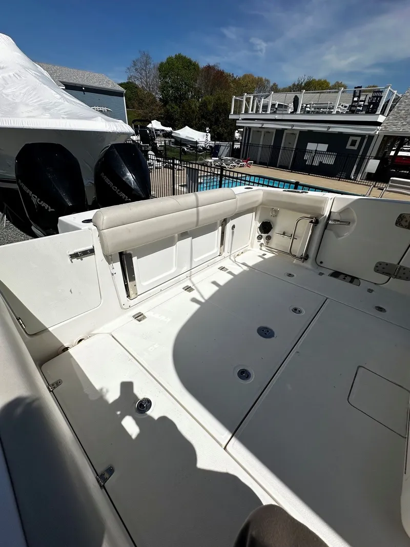 Slide: The Image of 2019 Boston Whaler 330 Outrage boat rear with engines. - 10