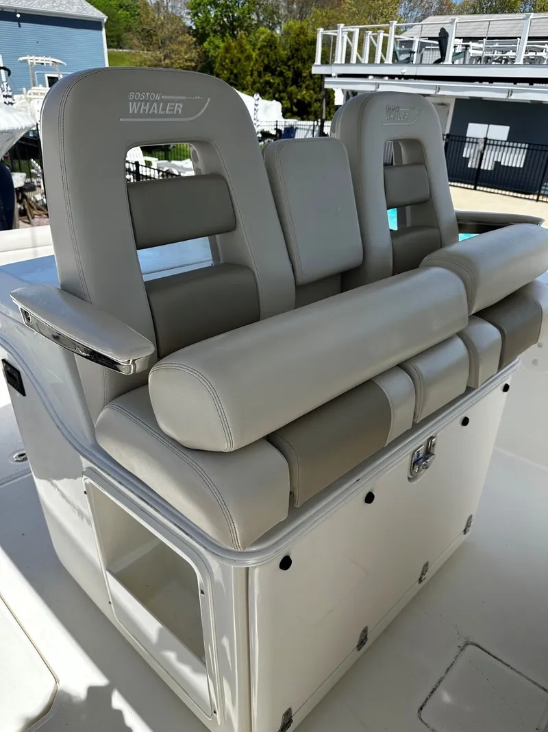 Slide: The Image of Boston Whaler 330 Outrage 2019, luxurious boat seating in light leather. - 23