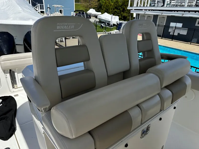 Slide: The Image of Boston Whaler 330 Outrage 2019, luxurious gray leather boat seating. - 24