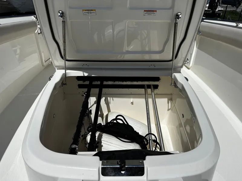 Slide: The Image of Storage compartment in 2019 Boston Whaler 330 Outrage boat. - 38
