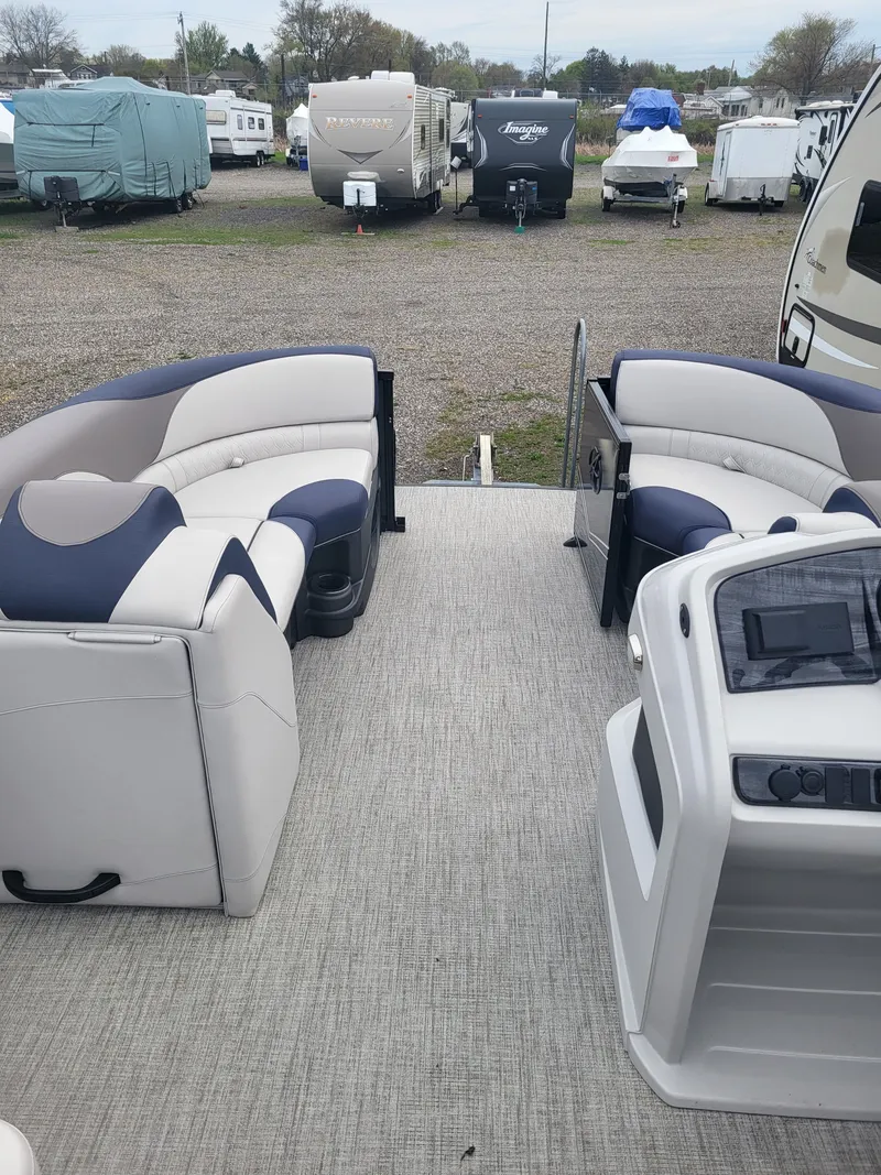 Slide: The Image of Interior of a 2023 Avalon 2385 LSZ pontoon boat on a parking lot. - 11