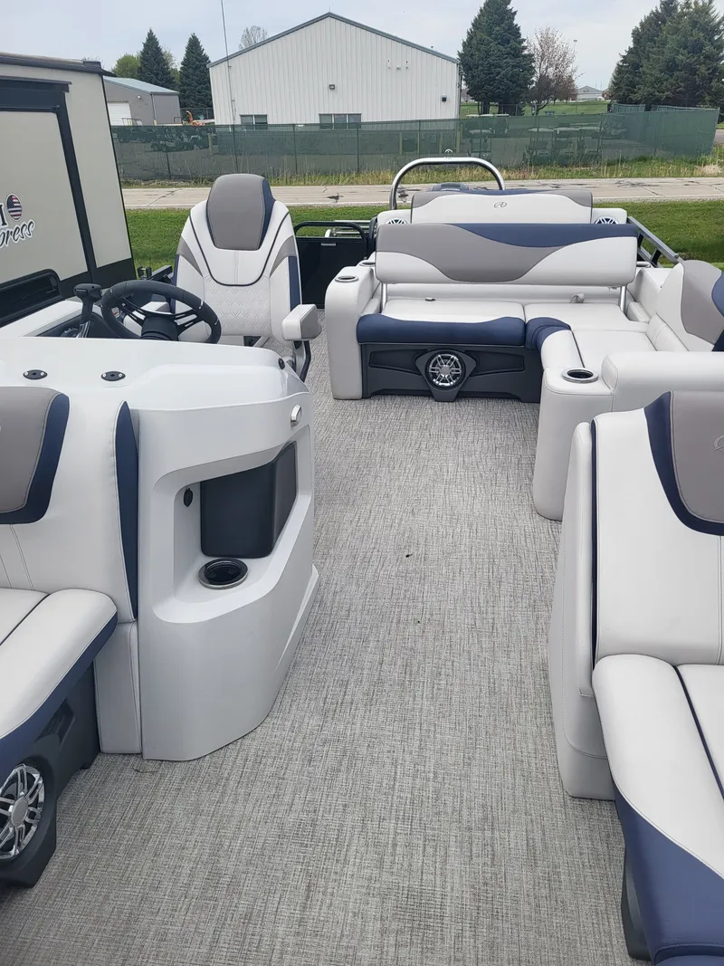 Slide: The Image of Interior of 2023 Avalon 2385 LSZ pontoon boat with gray and blue seating. - 12