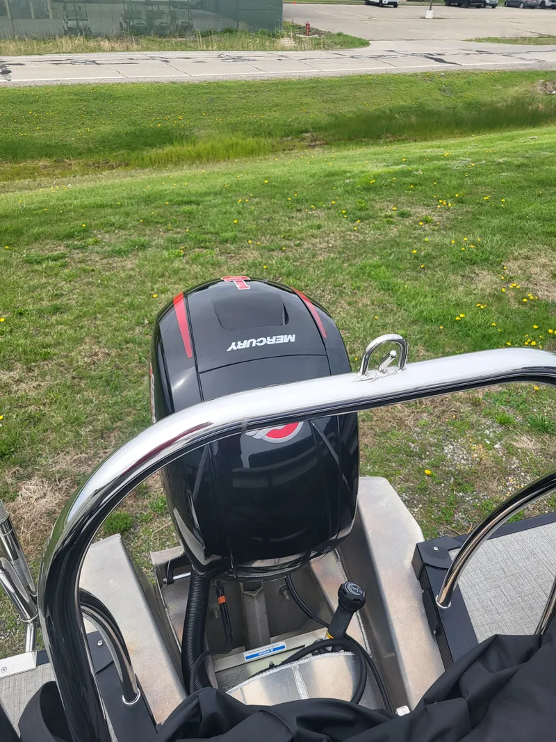 Slide: The Image of 2023 Avalon 2385 LSZ with Mercury outboard motor on grass. - 16