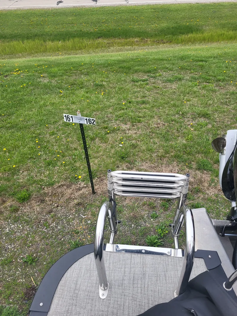 Slide: The Image of Avalon 2385 LSZ 2023 with ladder on green grass. - 17