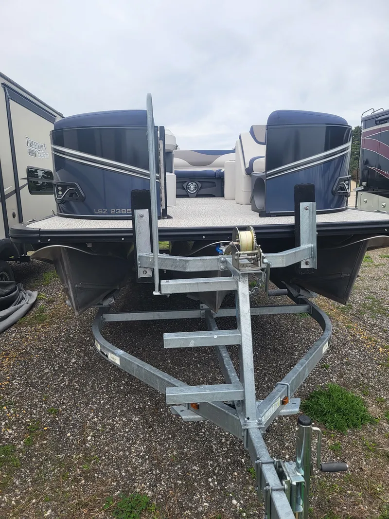 Slide: The Image of 2023 Avalon 2385 LSZ pontoon boat on trailer, side view. - 18