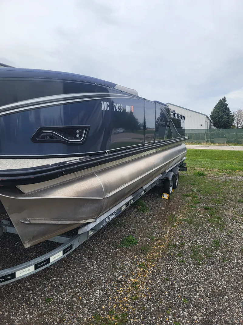 Slide: The Image of 2023 Avalon 2385 LSZ pontoon boat parked on trailer. - 19