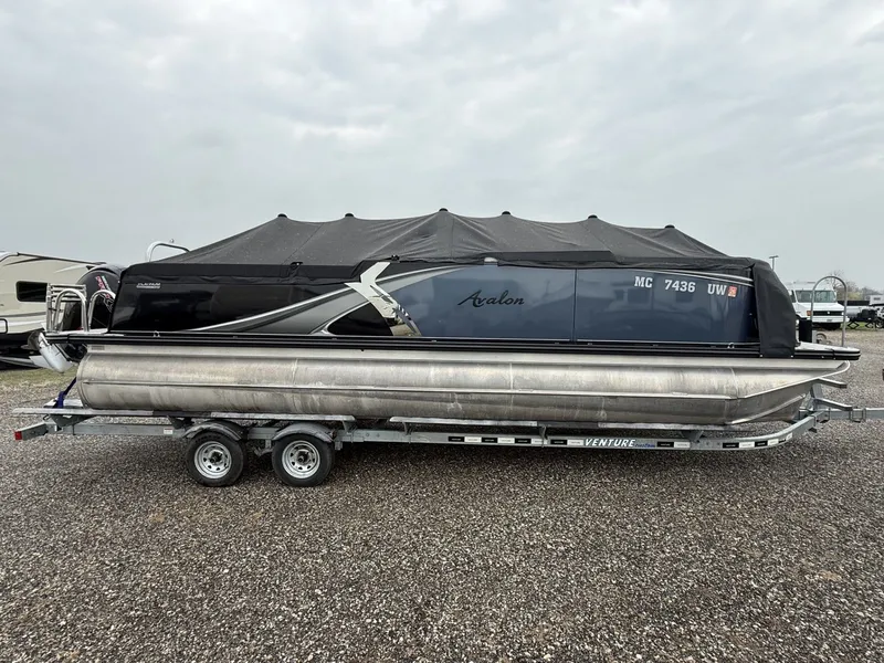 Slide: The Image of 2023 Avalon 2385 LSZ pontoon boat on trailer, side view. - 2