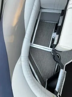 Slide: The Image of Interior of a 2023 Avalon 2385 LSZ boat with gray upholstery. - 22