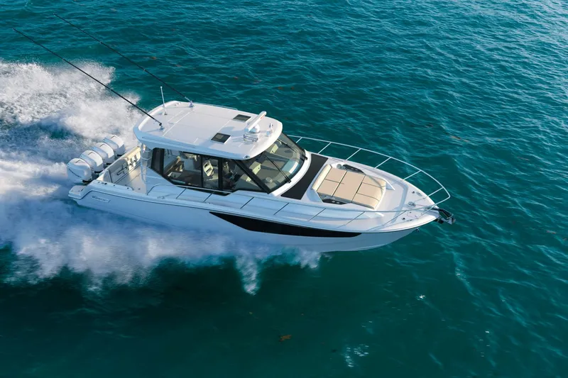 Slide: The Image of A white motorboat speeds across the blue water. - 11