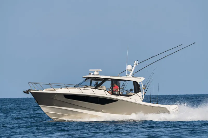 Slide: The Image of 2026 Boston Whaler 405 Conquest cruising on the water. - 30