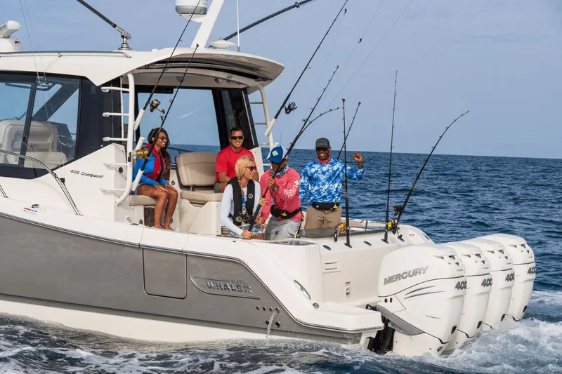 Slide: The Image of A group of people fishing on a Boston Whaler 405 Conquest at sea. - 39