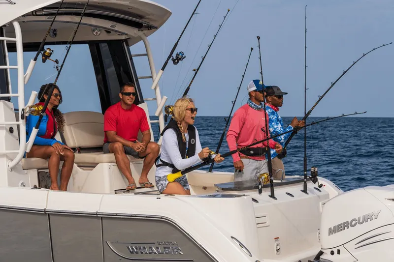 Slide: The Image of People fishing on a Boston Whaler 405 Conquest at sea. - 41