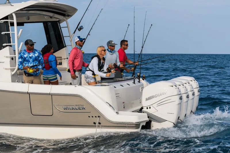 Slide: The Image of A group of people fishing on a Boston Whaler 405 Conquest at sea. - 27