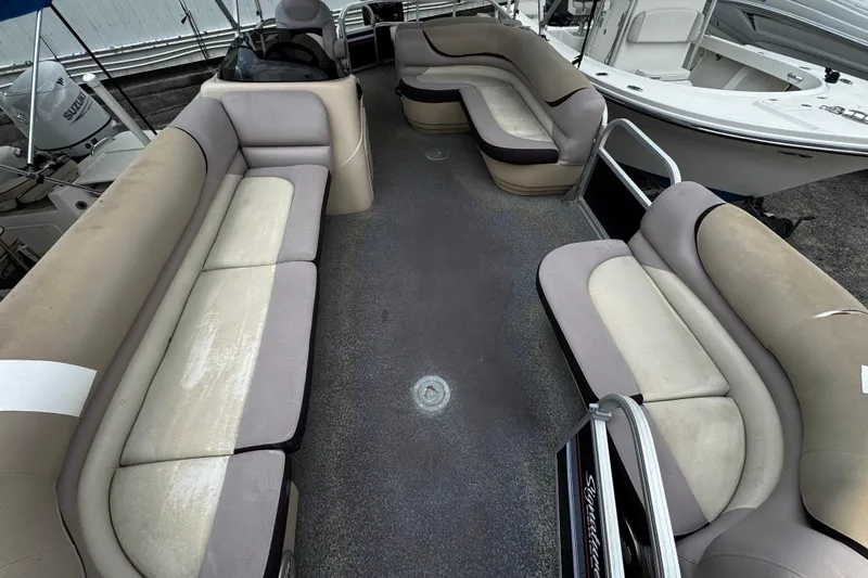Slide: The Image of 2015 Sun Tracker Party Barge 22 DLX interior with spacious seating and clean design. - 2