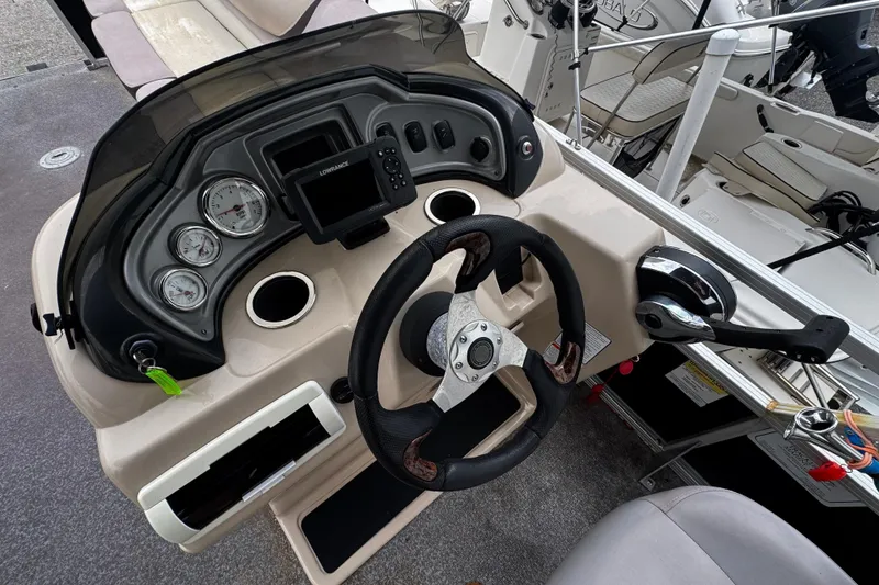 Slide: The Image of Dashboard of a 2015 Sun Tracker Party Barge 22 DLX pontoon boat. - 4