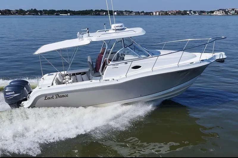 The Image of 2007 Polar 2700 Walkaround boat cruising on water with Yamaha engine. - 0