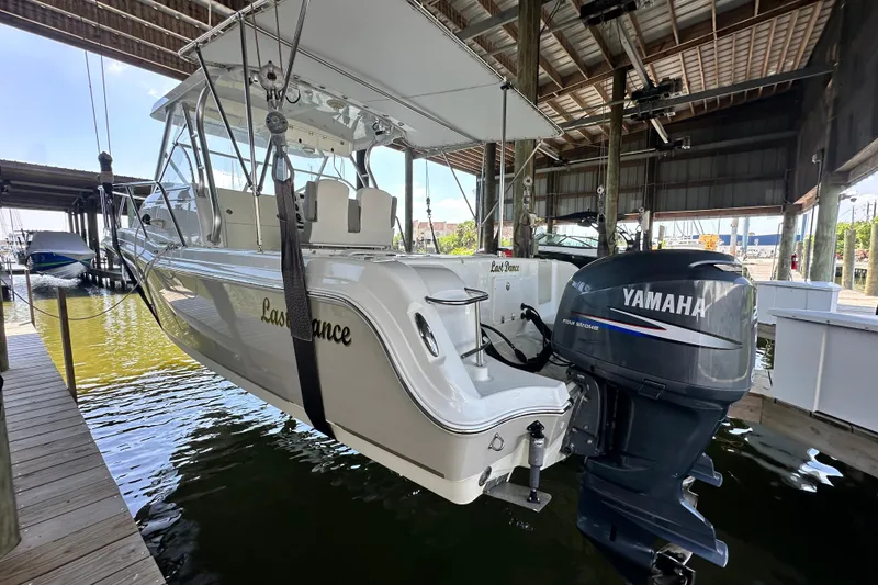 Slide: The Image of 2007 Polar 2700 Walkaround boat with Yamaha engine in docked position. - 16