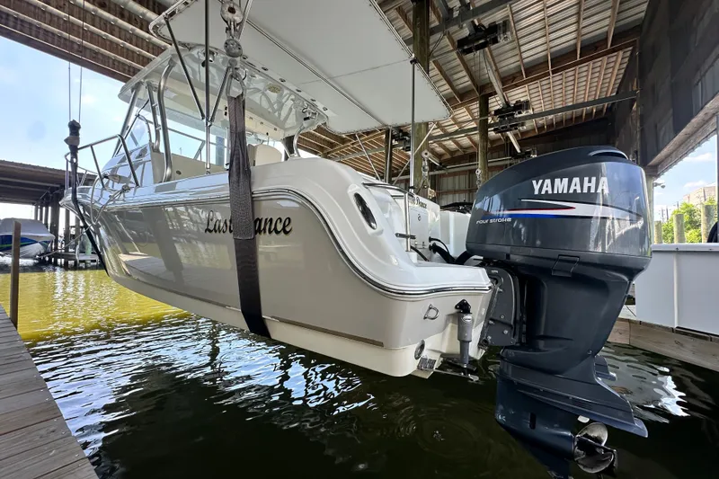 Slide: The Image of 2007 Polar 2700 Walkaround boat with Yamaha engine in a covered dock. - 17