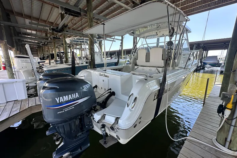 Slide: The Image of 2007 Polar 2700 Walkaround boat with Yamaha engine docked in marina. - 18