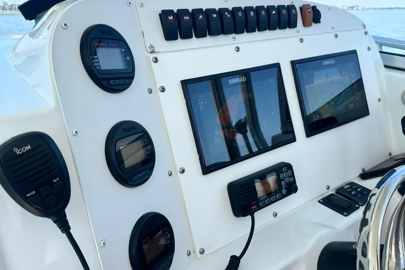 Slide: The Image of Dashboard of a 2007 Polar 2700 Walkaround boat with navigation and communication equipment. - 21