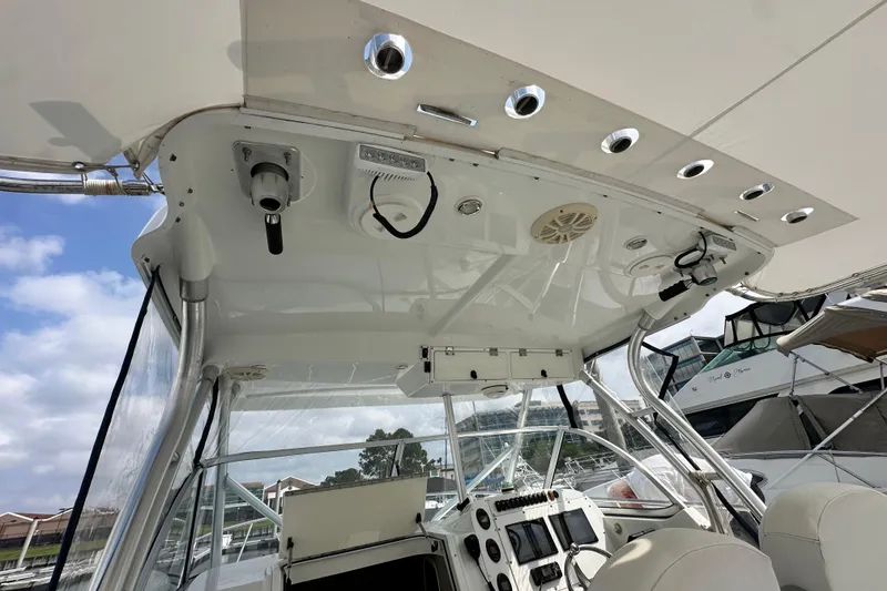 Slide: The Image of 2007 Polar 2700 Walkaround boat interior with control panel and overhead fixtures. - 24