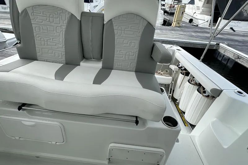 Slide: The Image of 2007 Polar 2700 Walkaround boat seating area with gray and white upholstery. - 26