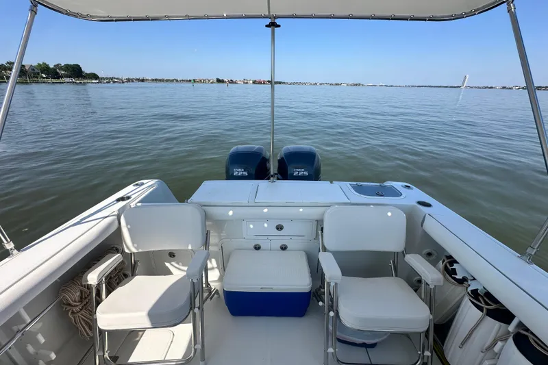 Slide: The Image of 2007 Polar 2700 Walkaround boat interior with seating and twin Yamaha 225 engines. - 32