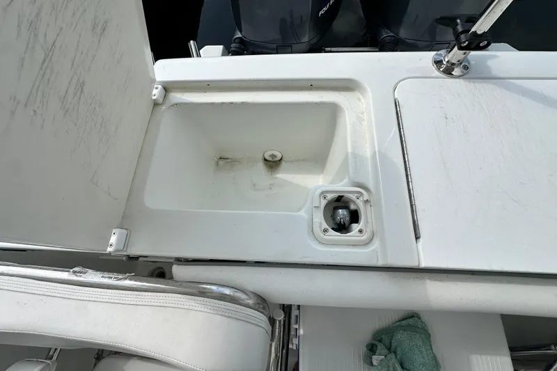 Slide: The Image of 2007 Polar 2700 Walkaround boat sink and storage compartment detail. - 33