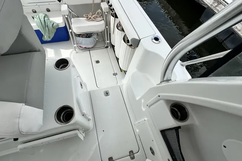 Slide: The Image of 2007 Polar 2700 Walkaround boat interior with seating and cup holders. - 36