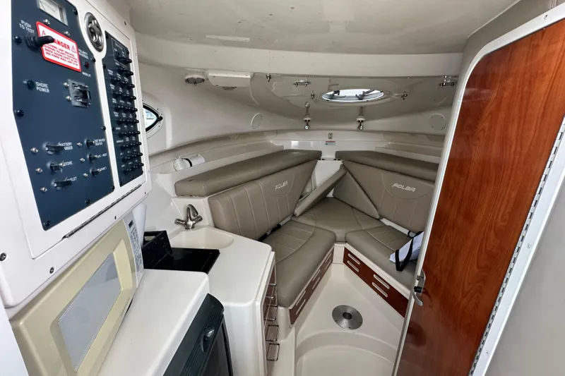 Slide: The Image of 2007 Polar 2700 Walkaround cabin interior with seating, control panel, and wood accents. - 40