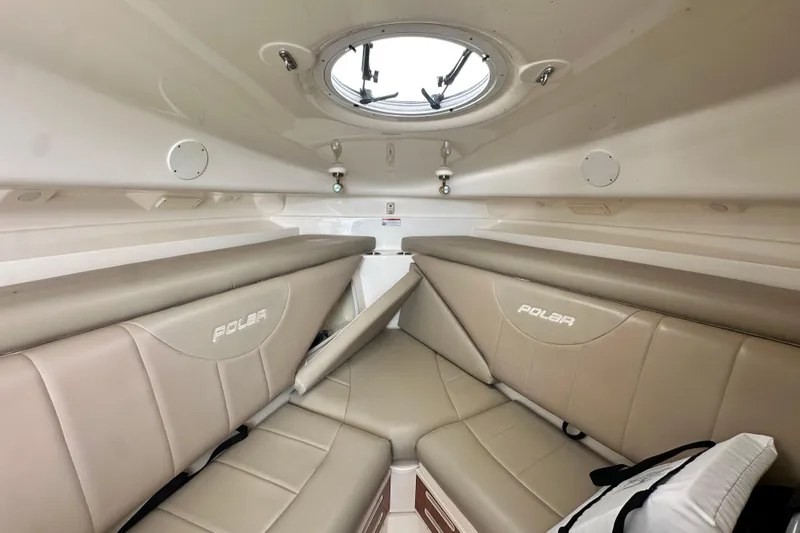 Slide: The Image of 2007 Polar 2700 Walkaround cabin interior with beige seating and overhead porthole. - 41