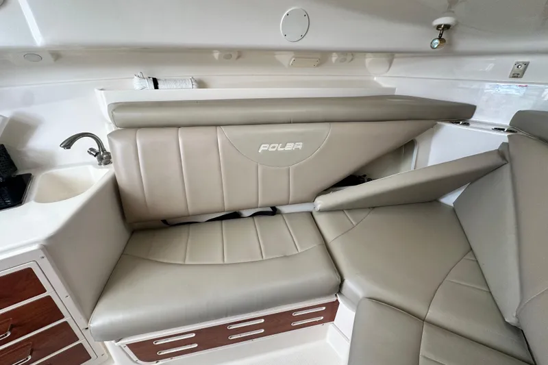 Slide: The Image of 2007 Polar 2700 Walkaround boat interior with beige seating and compact sink area. - 43
