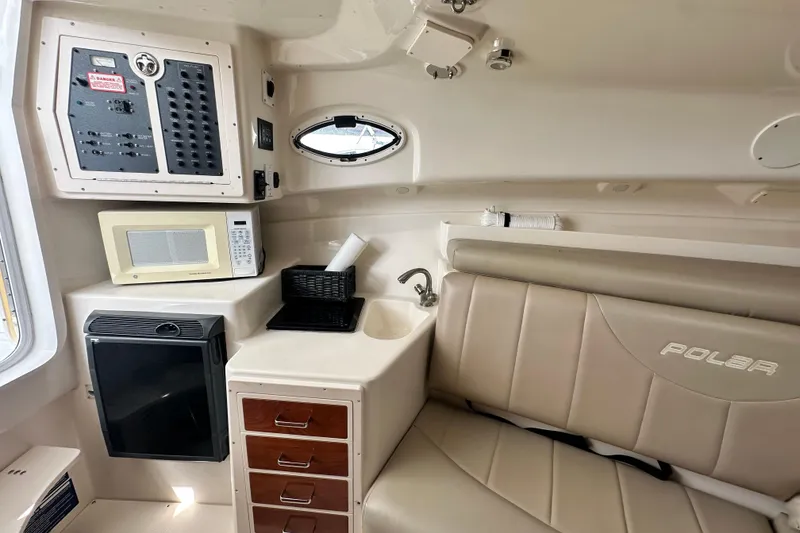Slide: The Image of 2007 Polar 2700 Walkaround cabin interior with kitchenette, seating, and control panel. - 44