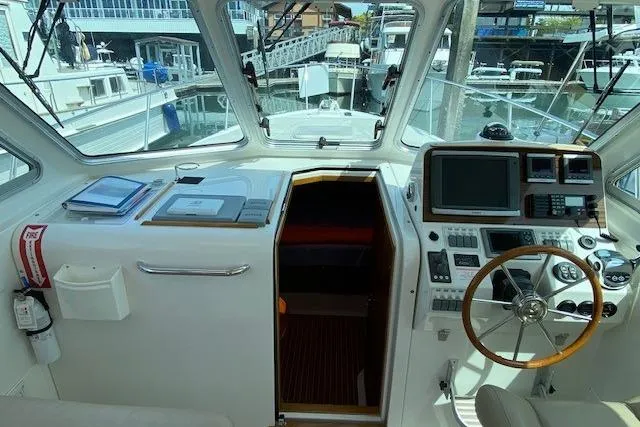 Slide: The Image of Interior view of a 2013 Back Cove 34 boat cockpit with navigation equipment. - 5